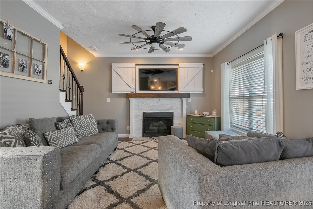3524 Talus Road Fayetteville, NC 28306 - Photo 17 of 47 a living room with furniture and a fireplace