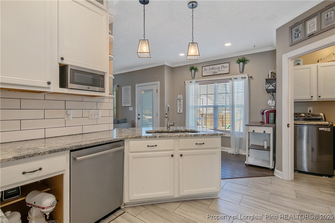 3524 Talus Road Fayetteville, NC 28306 - Photo 24 of 47 a kitchen with a sink stove and refrigerator