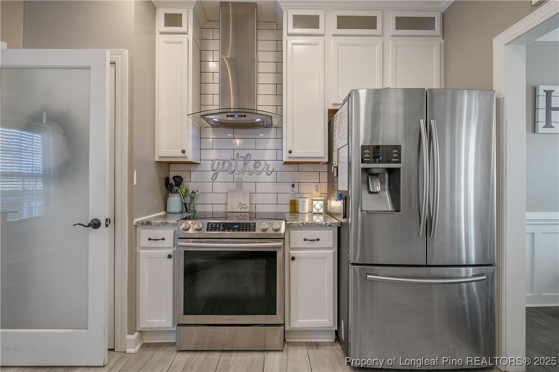 3524 Talus Road Fayetteville, NC 28306 - Photo 25 of 47 a kitchen with cabinets and stainless steel appliances