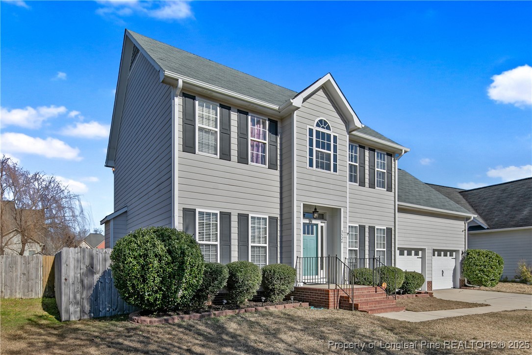 3524 Talus Road Fayetteville, NC 28306 - Photo 3 of 47 a front view of a house with a yard