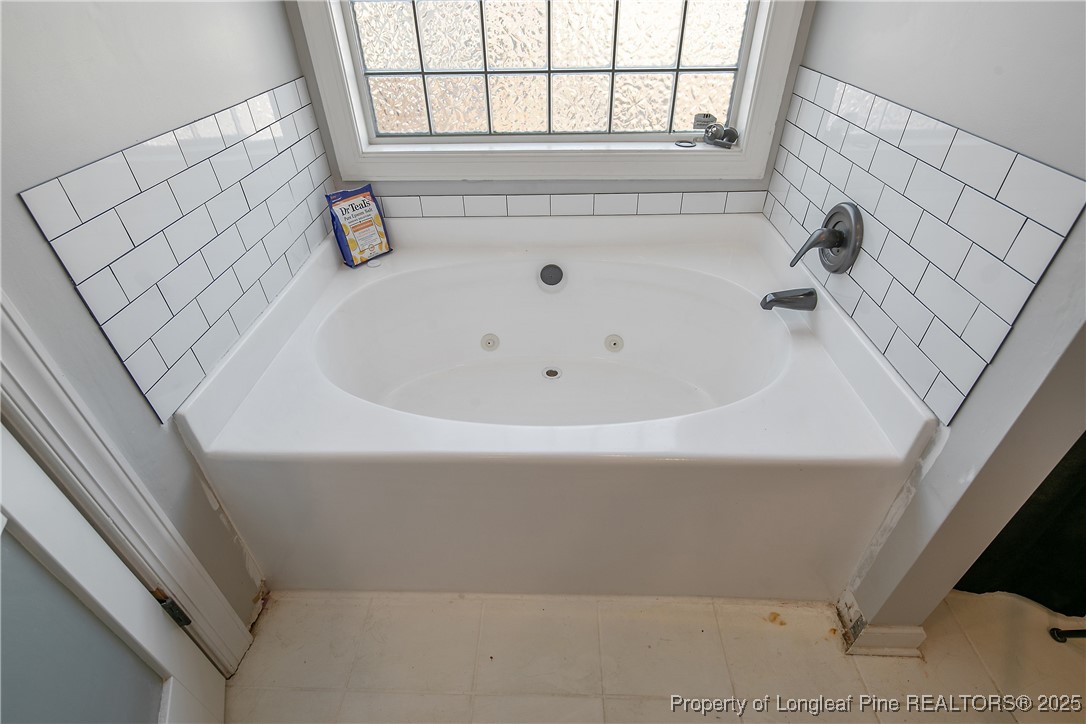 3524 Talus Road Fayetteville, NC 28306 - Photo 35 of 47 a bathroom with a white bathtub