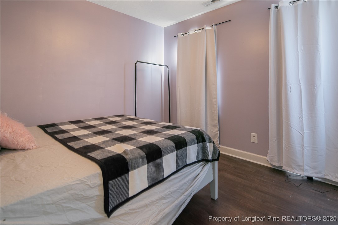 3524 Talus Road Fayetteville, NC 28306 - Photo 42 of 47 a bedroom with a bed and a mirror