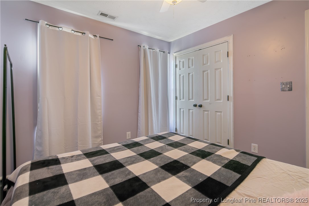 3524 Talus Road Fayetteville, NC 28306 - Photo 43 of 47 a view of a bedroom with a black and white checkered floor