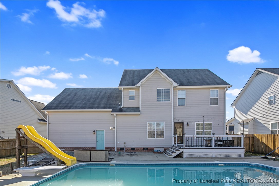 3524 Talus Road Fayetteville, NC 28306 - Photo 6 of 47 a view of pool with lawn chairs and potted plants