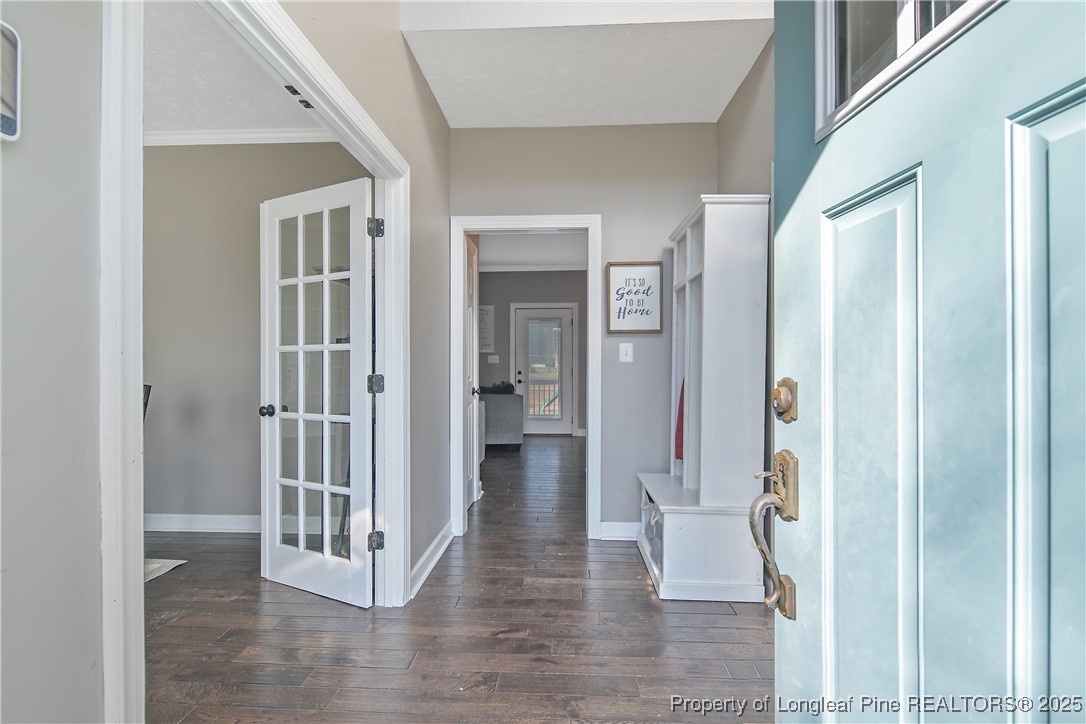 3524 Talus Road Fayetteville, NC 28306 - Photo 9 of 47 a view of a hallway with wooden floor and entryway