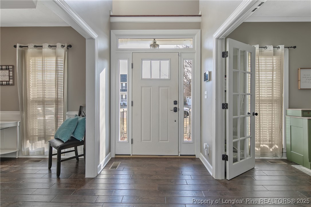 3524 Talus Road Fayetteville, NC 28306 - Photo 10 of 47 a view of a hallway with wooden floor and windows