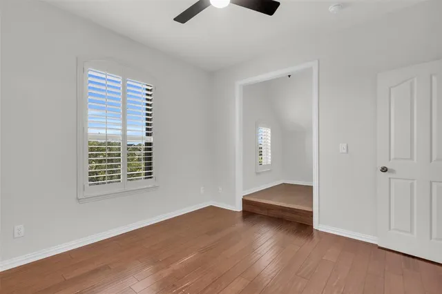 a view of livingroom with hardwood floor and ceiling fan
