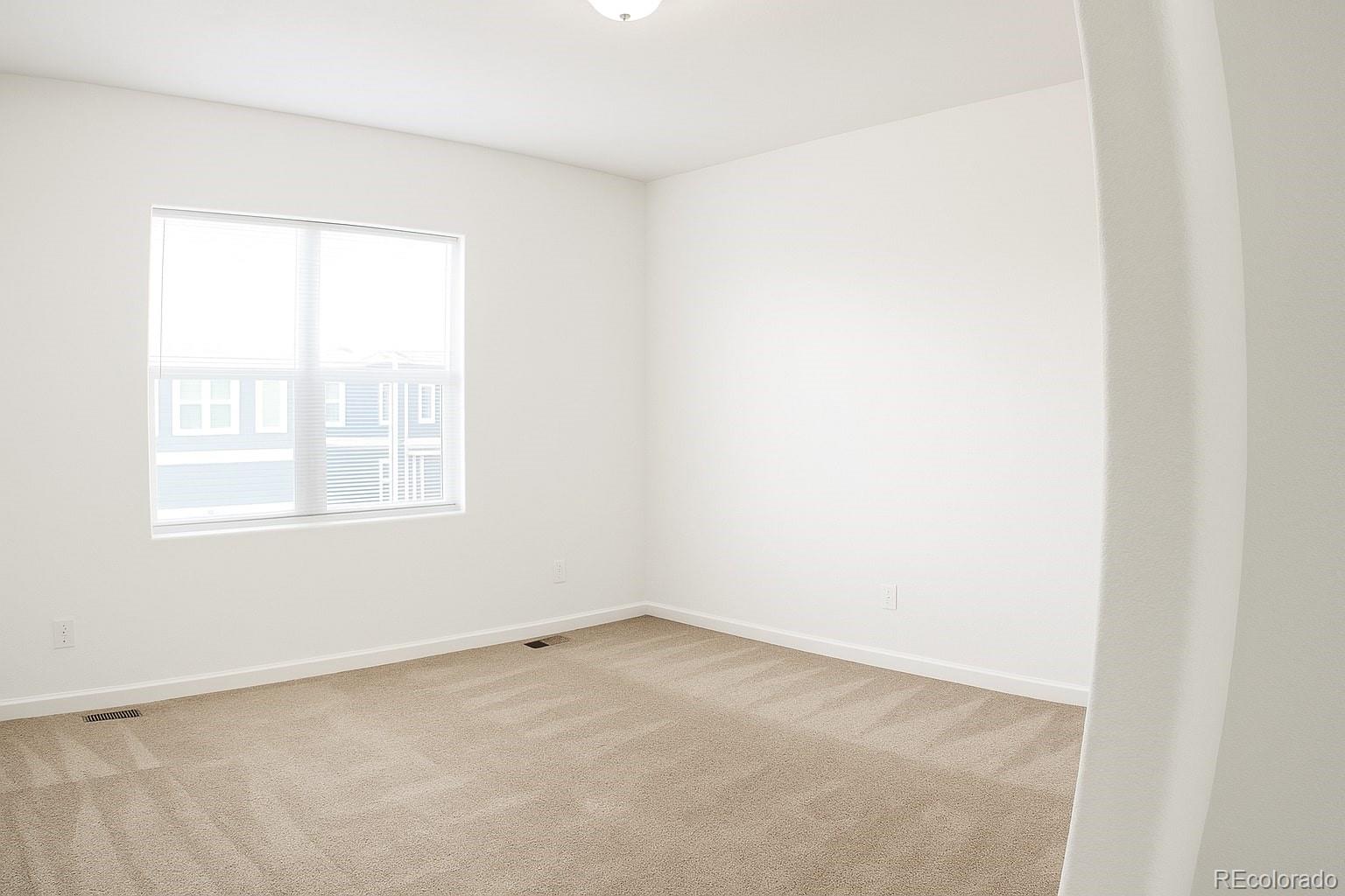 3583 East Uintah Street, Unit 102 Colorado Springs, CO 80909 - Photo 15 of 23 an empty room with a window
