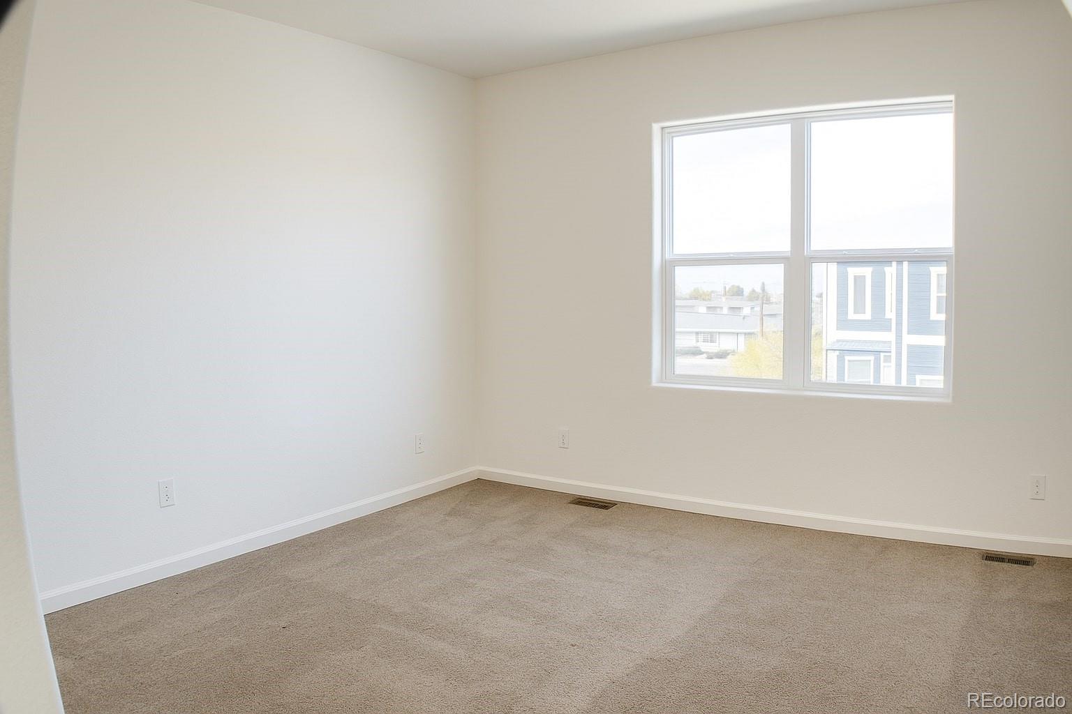3583 East Uintah Street, Unit 102 Colorado Springs, CO 80909 - Photo 16 of 23 an empty room with a window