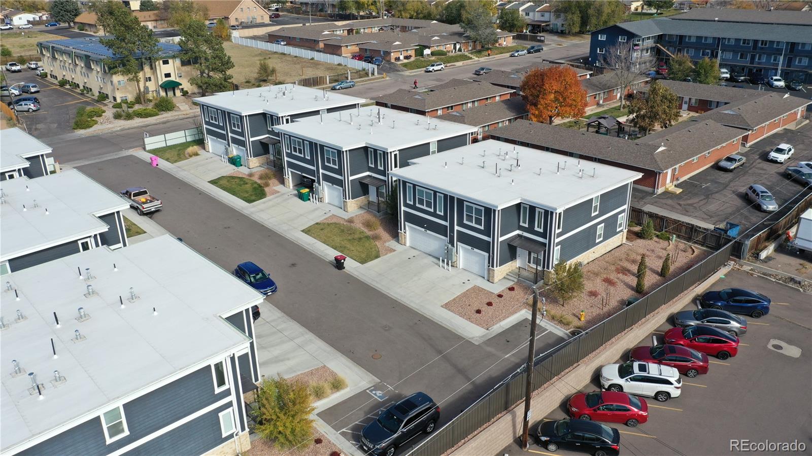 3583 East Uintah Street, Unit 102 Colorado Springs, CO 80909 - Photo 22 of 23 an aerial view of an buildings and street