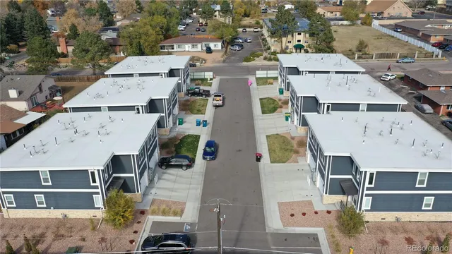an aerial view of residential houses with outdoor space