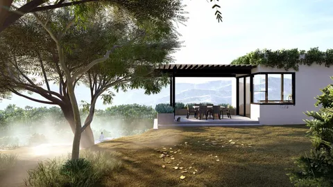 a view of a house with backyard and sitting area