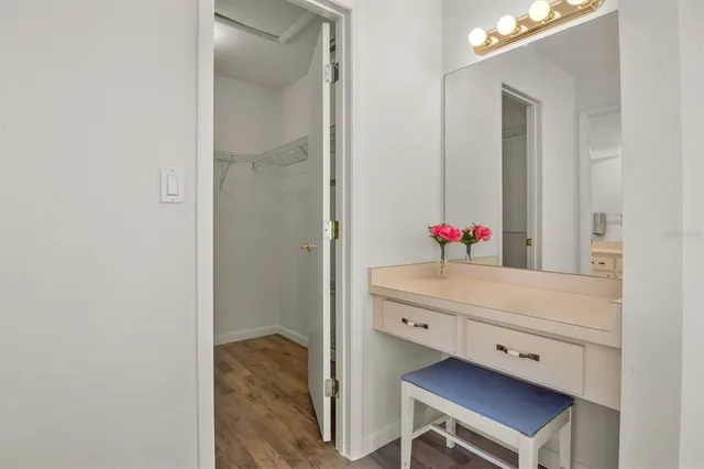 a bathroom with a sink vanity and a mirror