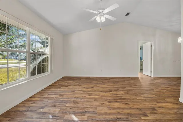 a view of an empty room with a window