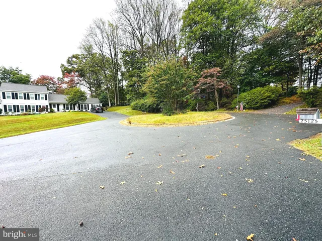 a view of a swimming pool with an outdoor space and seating area