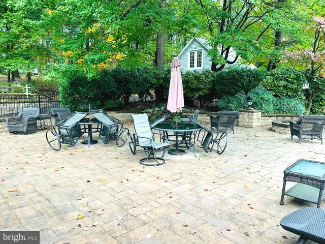 a view of house with yard and sitting area