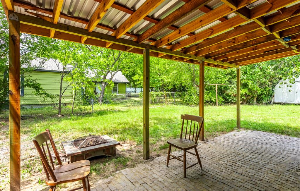1619 McCormick Street Denton, TX 76205 - Photo 4 of 12 a view of yard with porch and outdoor seating