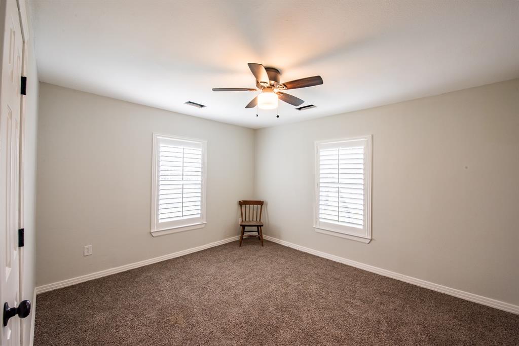 1619 McCormick Street Denton, TX 76205 - Photo 8 of 12 a view of an empty room with a window