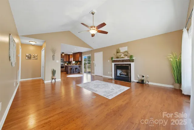wooden floor in an empty room with a fireplace