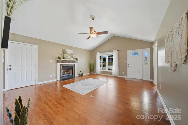 wooden floor in an empty room with a fireplace