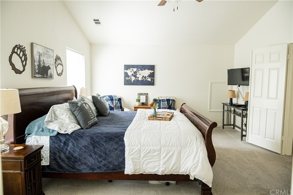 39301 Moonray Lane Oakhurst, CA 93644 - Photo 11 of 41 a bedroom with a bed and a flat screen tv