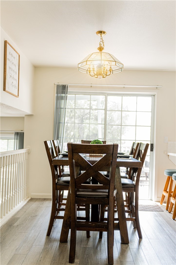 39301 Moonray Lane Oakhurst, CA 93644 - Photo 23 of 41 a view of a dining room with furniture window and wooden floor