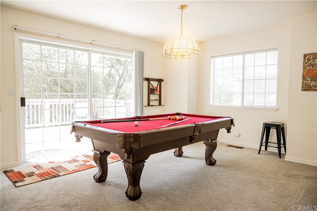 39301 Moonray Lane Oakhurst, CA 93644 - Photo 26 of 41 a room with pool table and windows