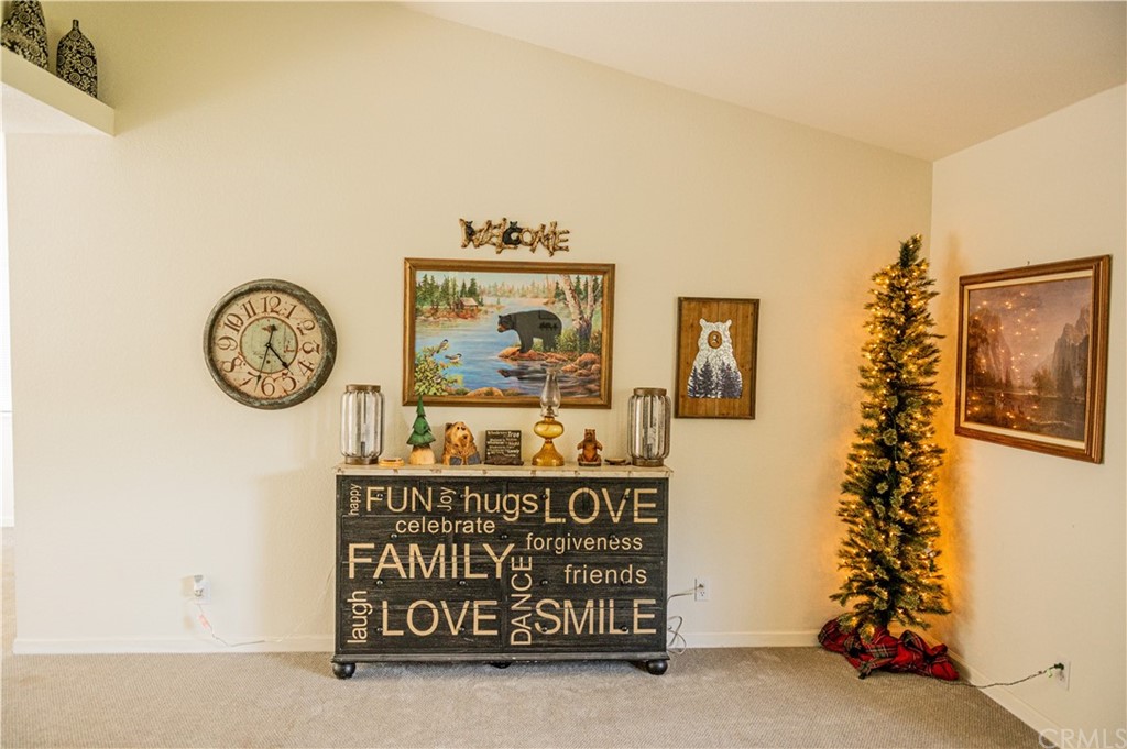 39301 Moonray Lane Oakhurst, CA 93644 - Photo 28 of 41 a clock on a wall next to a small yard