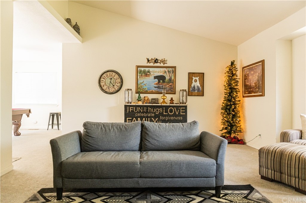 39301 Moonray Lane Oakhurst, CA 93644 - Photo 29 of 41 a living room with a couch and a window