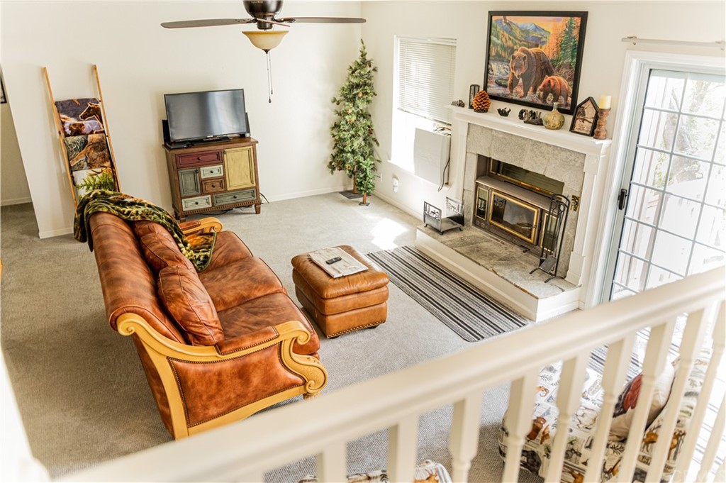 39301 Moonray Lane Oakhurst, CA 93644 - Photo 32 of 41 a living room with furniture fireplace and flat screen tv