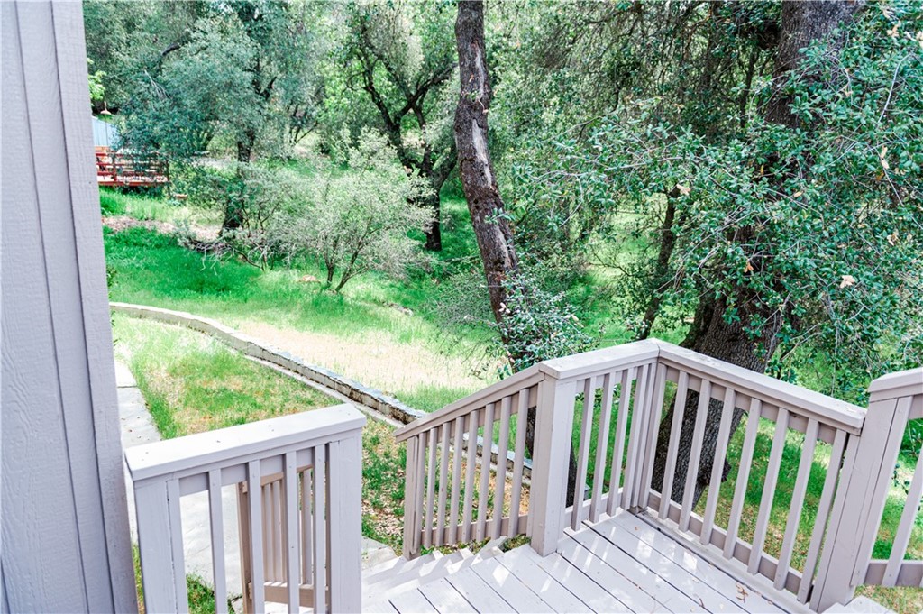 39301 Moonray Lane Oakhurst, CA 93644 - Photo 33 of 41 a view of balcony with deck and wooden floor