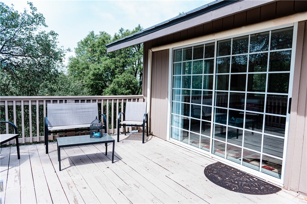 39301 Moonray Lane Oakhurst, CA 93644 - Photo 34 of 41 a view of a chairs and a table in the balcony