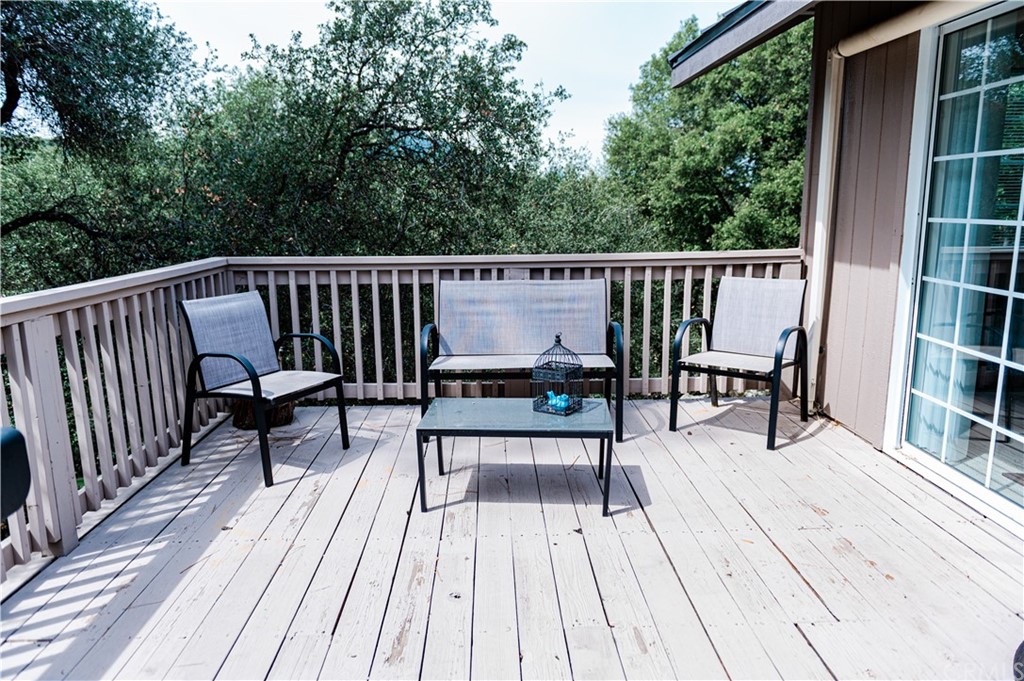 39301 Moonray Lane Oakhurst, CA 93644 - Photo 35 of 41 a view of roof deck with chairs and wooden floor