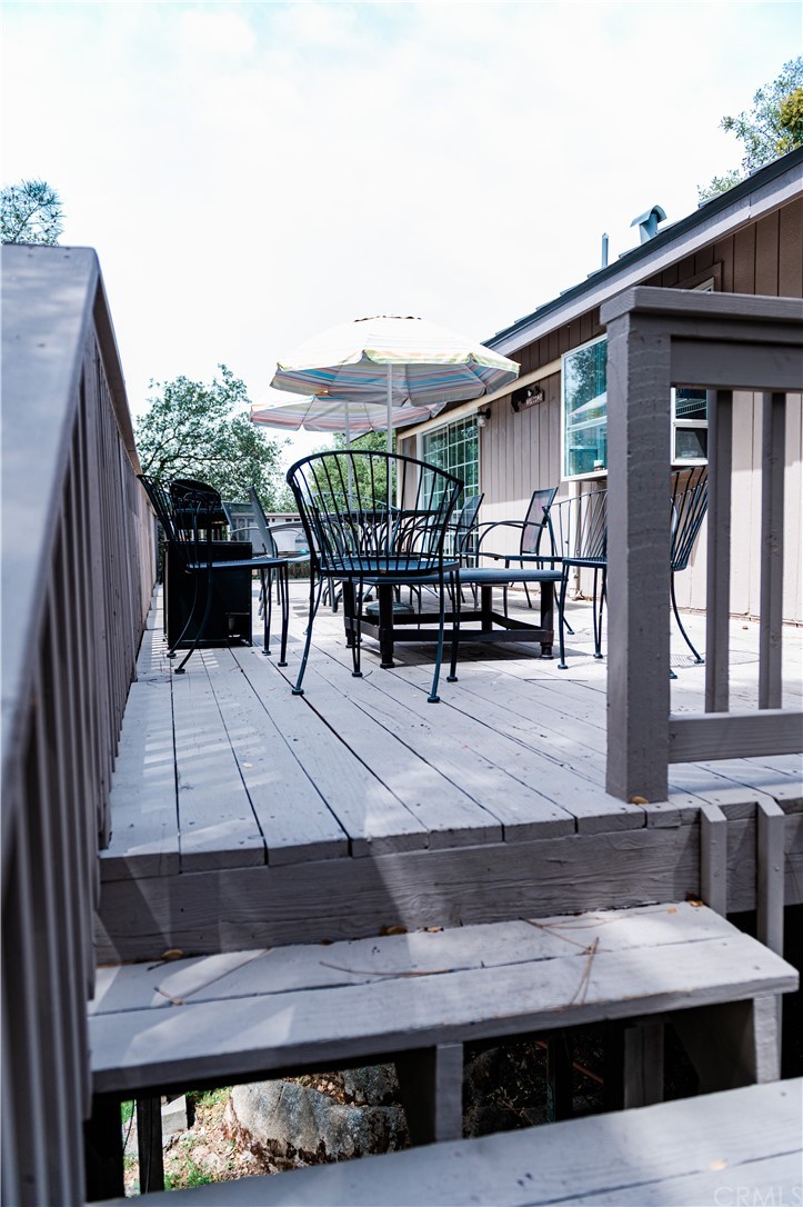 39301 Moonray Lane Oakhurst, CA 93644 - Photo 36 of 41 a terrace of a house with outdoor seating
