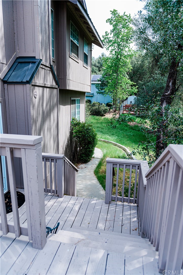 39301 Moonray Lane Oakhurst, CA 93644 - Photo 37 of 41 a view of backyard with a patio and plants
