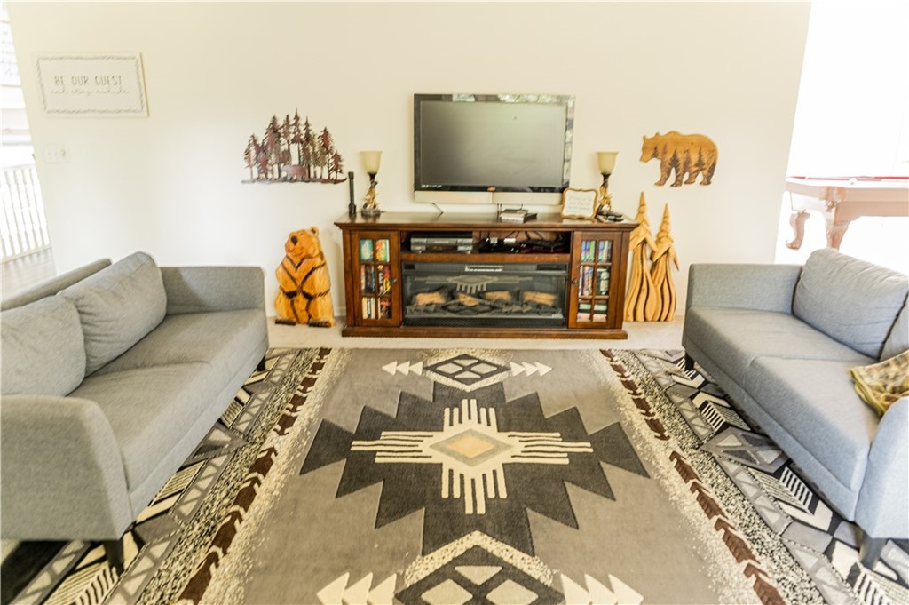 39301 Moonray Lane Oakhurst, CA 93644 - Photo 5 of 41 a living room with furniture and a flat screen tv