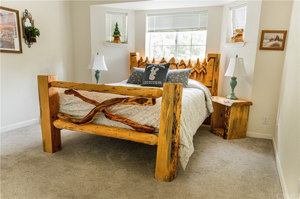 39301 Moonray Lane Oakhurst, CA 93644 - Photo 9 of 41 a bed room with a bed and a chair