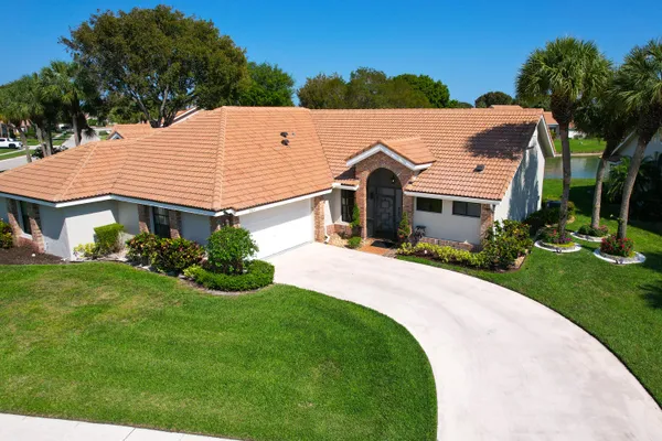 an aerial view of a houses and an outdoor space