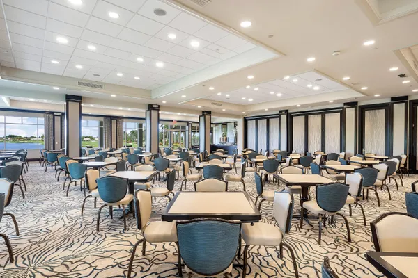 a view of a dining room with furniture wooden floor and chandelier