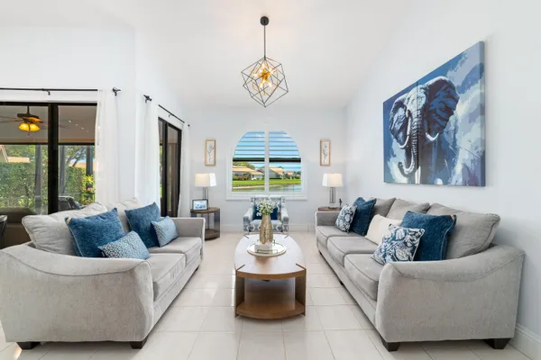 a kitchen with kitchen island granite countertop a sink dishwasher stove and oven with cabinets