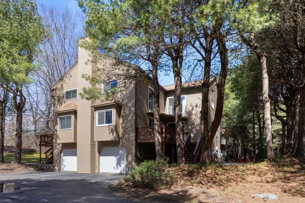 106 Captain Eames Circle, Unit 106 Ashland, MA 01721 - Photo 1 of 21 a view of a house with a tree in front