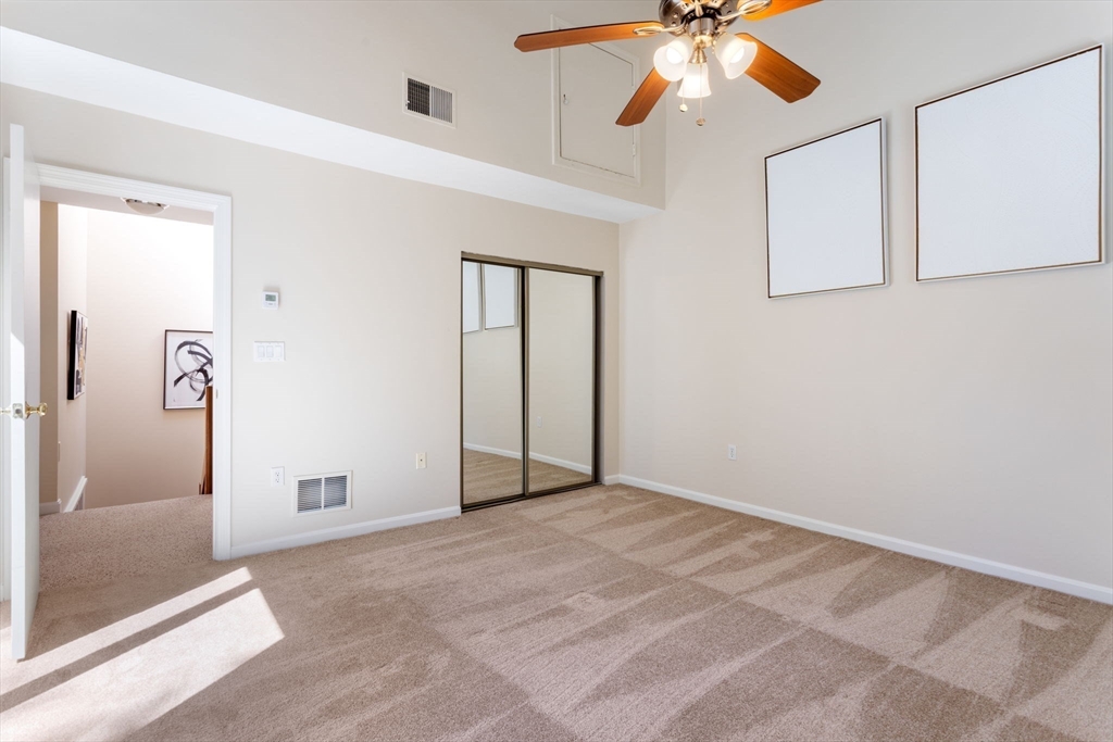 106 Captain Eames Circle, Unit 106 Ashland, MA 01721 - Photo 11 of 21 a view of an empty room with window and cabinet