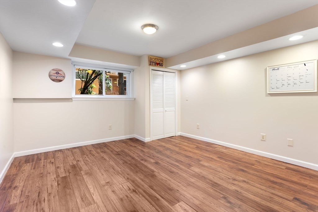106 Captain Eames Circle, Unit 106 Ashland, MA 01721 - Photo 15 of 21 a view of an empty room with wooden floor
