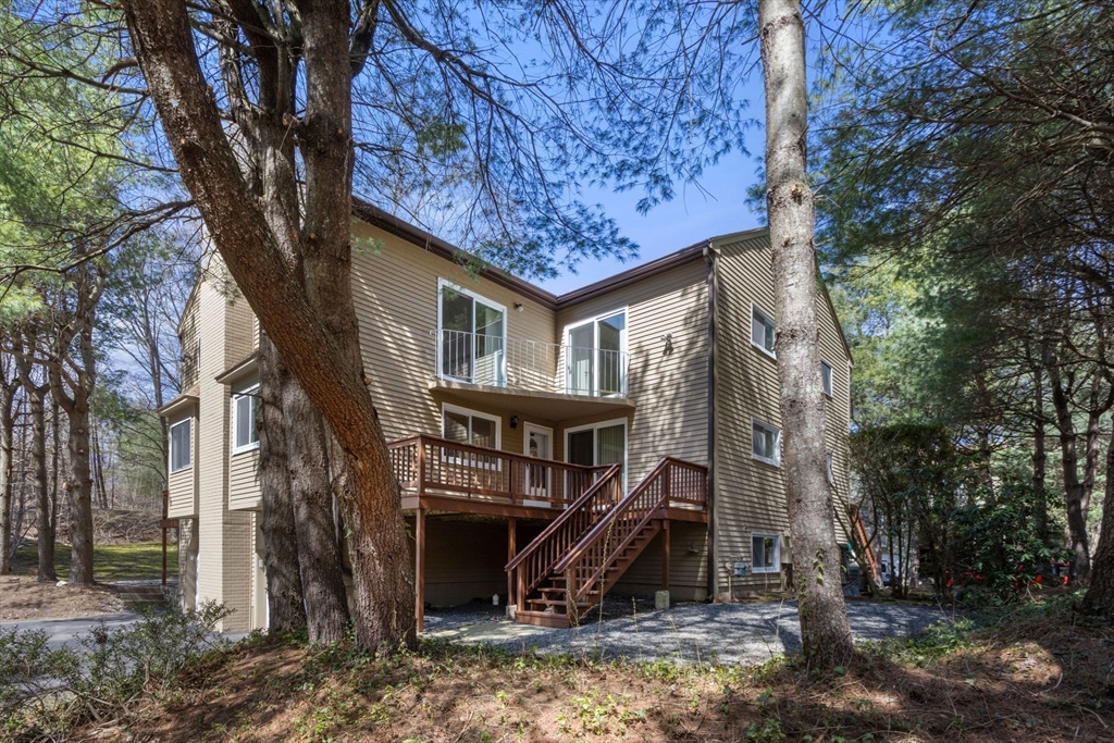 106 Captain Eames Circle, Unit 106 Ashland, MA 01721 - Photo 16 of 21 a view of a house with a yard