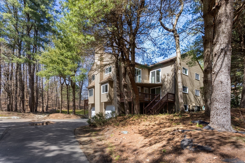 106 Captain Eames Circle, Unit 106 Ashland, MA 01721 - Photo 18 of 21 a view of a house with a tree in front