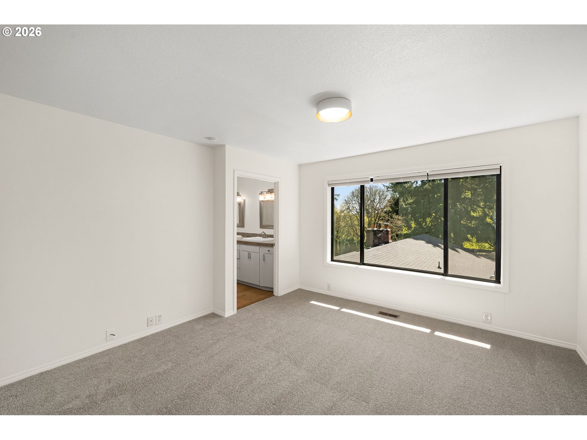 5844 Southwest Ralston Drive Portland, OR 97239 - Photo 21 of 43 a view of a room with large windows