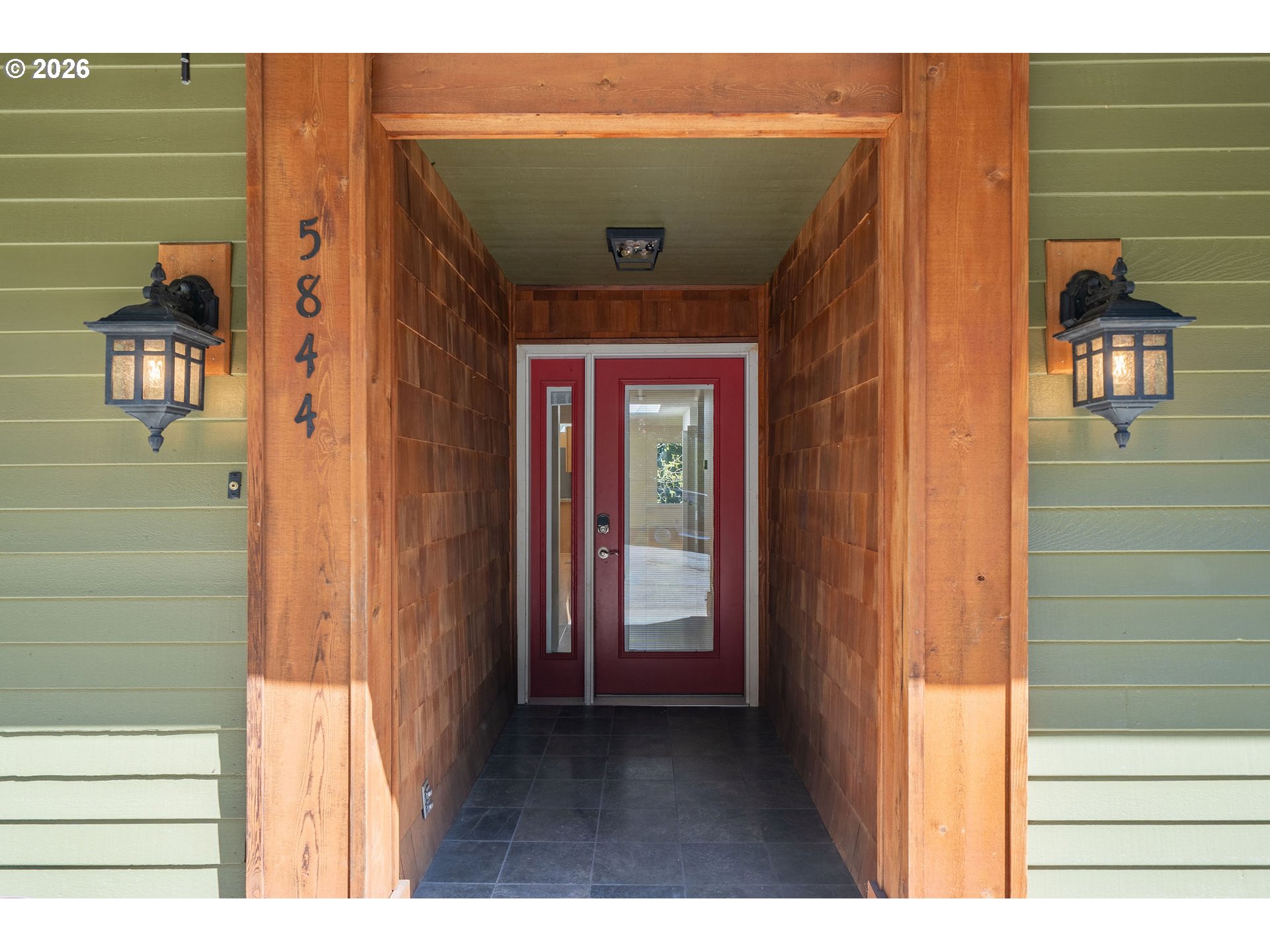 5844 Southwest Ralston Drive Portland, OR 97239 - Photo 3 of 43 a view of a wooden door