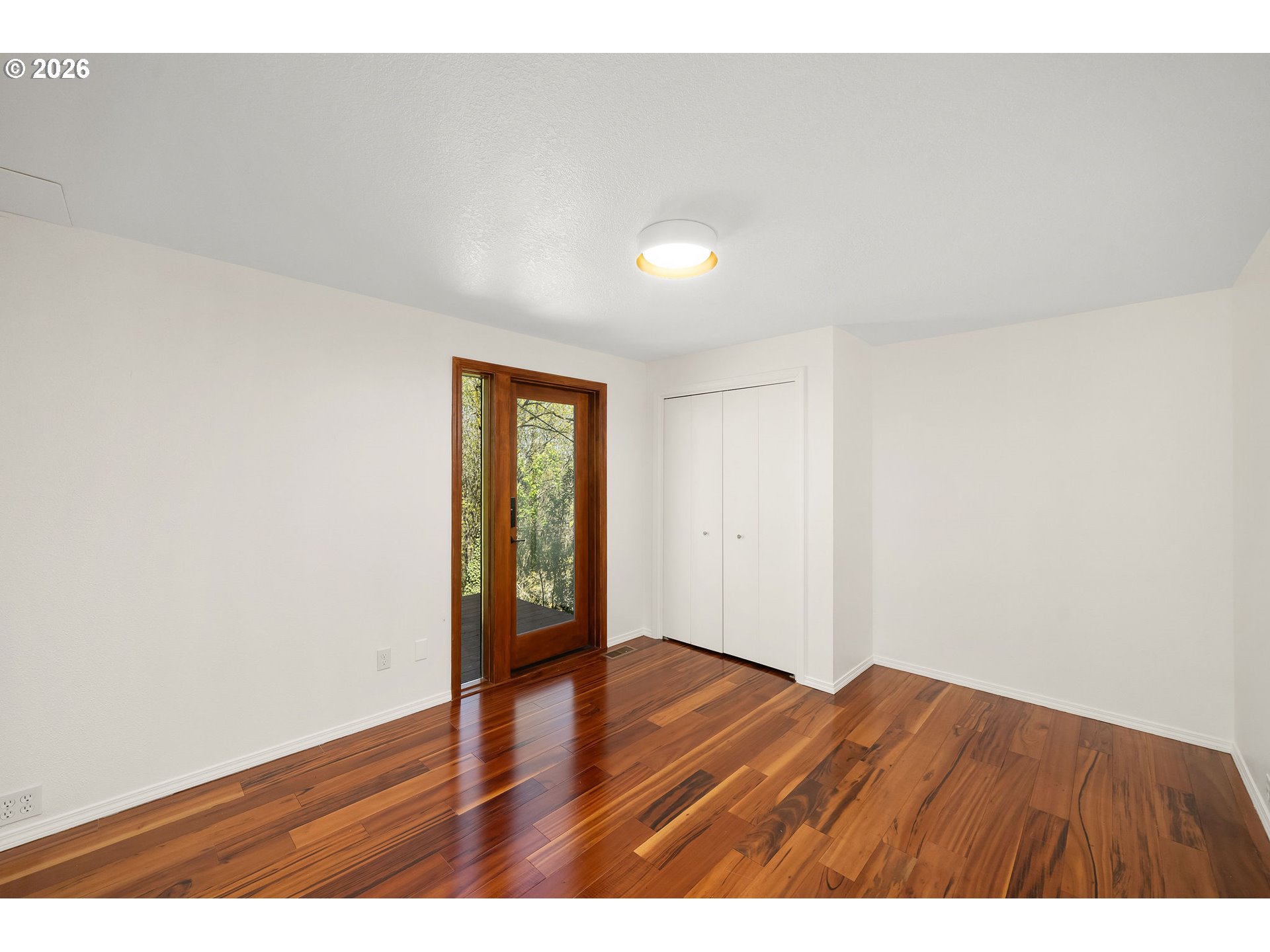 5844 Southwest Ralston Drive Portland, OR 97239 - Photo 31 of 43 a view of an empty room and wooden floor