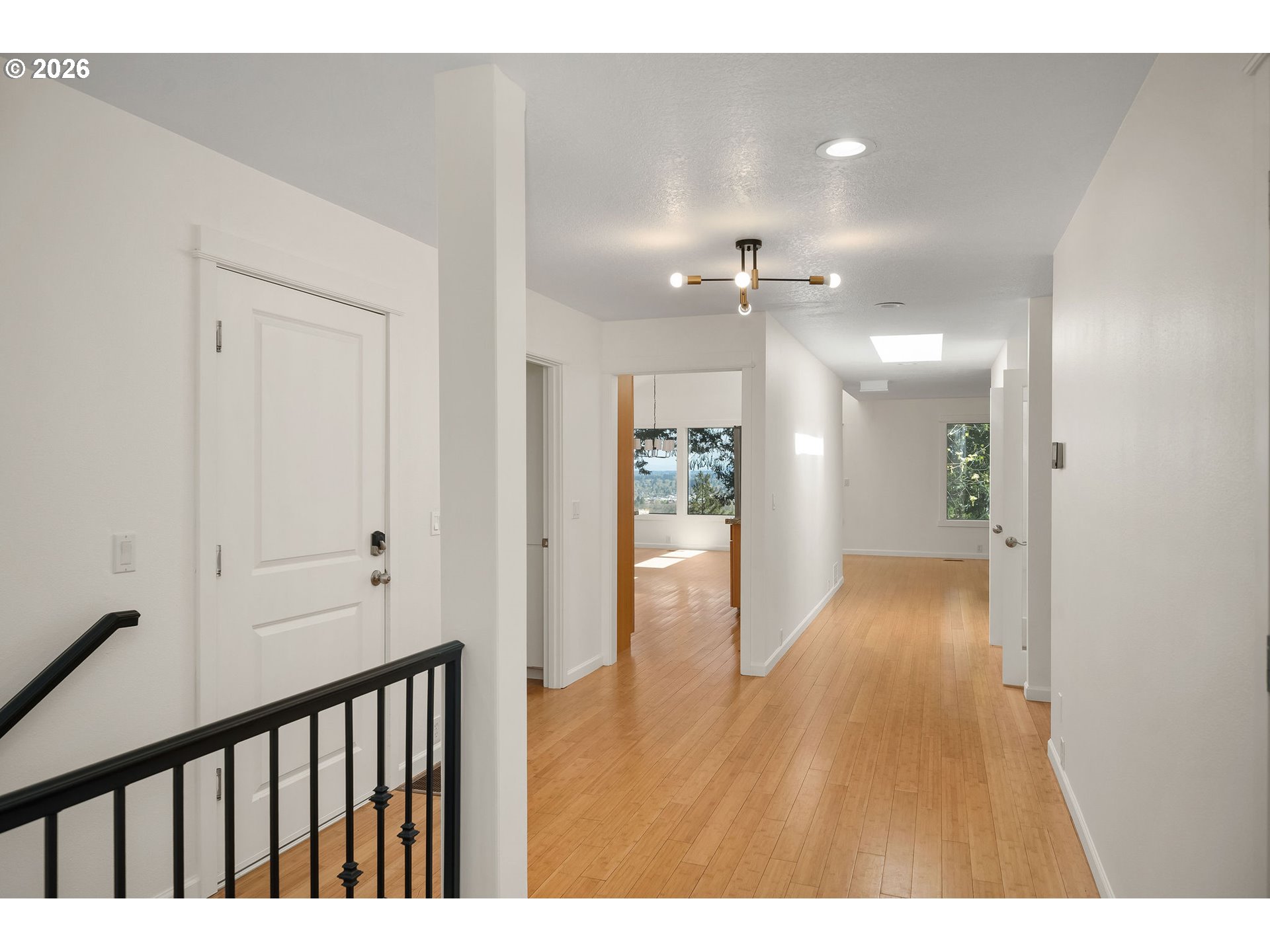 5844 Southwest Ralston Drive Portland, OR 97239 - Photo 5 of 43 a view of hallway with wooden floor