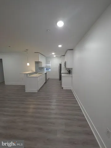 a view of kitchen with wooden floor